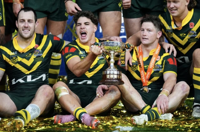 Australia's Reece Walsh (centre) with the trophy