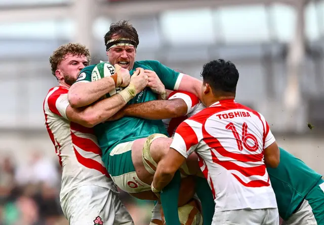 Ryan Baird is lifted into the air