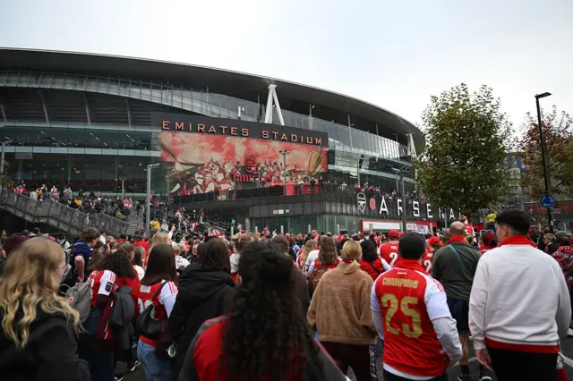Arsenal fans arrive at the stadium