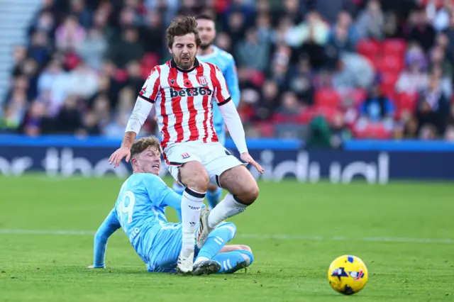 Ben Pearson of Stoke City and Victor Torp of Coventry City
