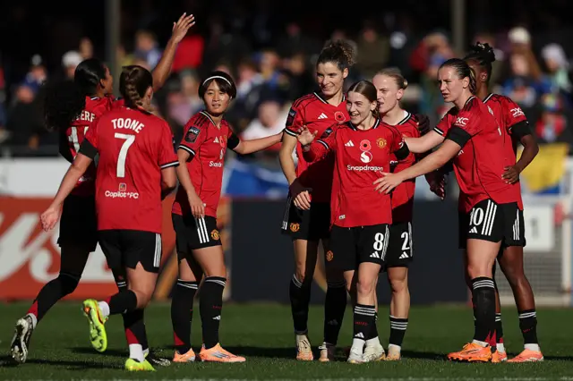 UNited players celebrate with Park after her goal v Brighton