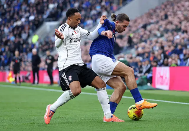 Kenny Tete and Jack Grealish compete for the ball
