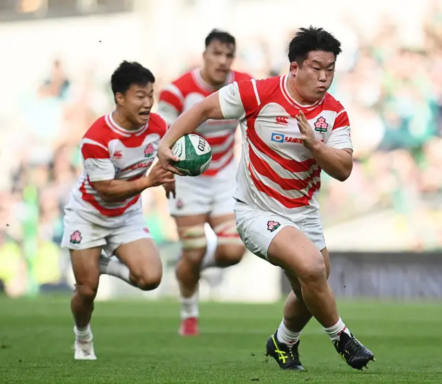 Shuhei Takeuchi of Japan runs with the ball during the match between Ireland and Japan