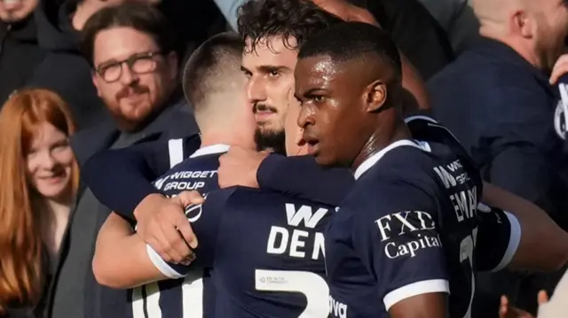Millwall's Mihailo Ivanovic (centre) celebrates with team-mates