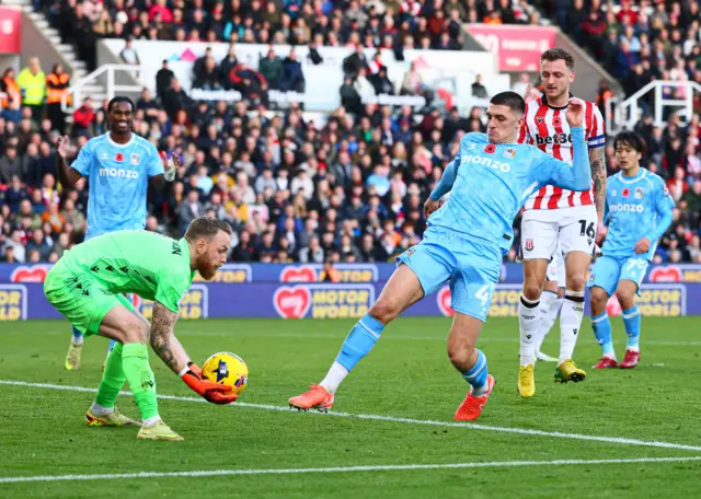 Bobby Thomas of Coventry City and Viktor Johansson of Stoke City