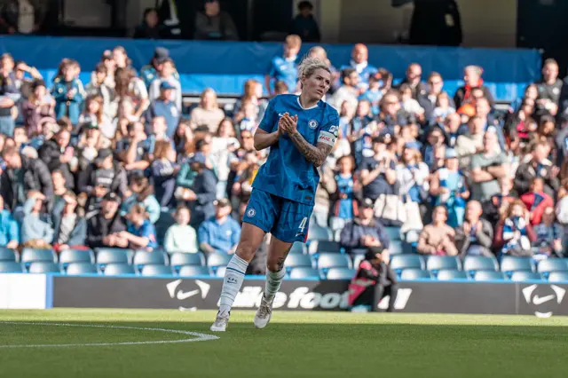 Chelsea captain Bright claps the fans at Stamford Bridge