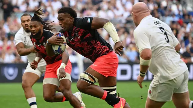 Fiji's number eight Viliame Mata runs to score his team's first try against England during the 2023 World Cup quarter-final