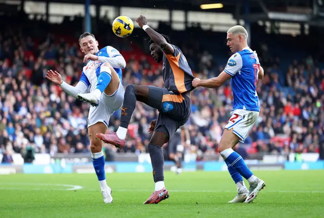 Patrick Agyemang of Derby County battles for possession with Sean McLoughlin and Lewis Miller of Blackburn Rovers