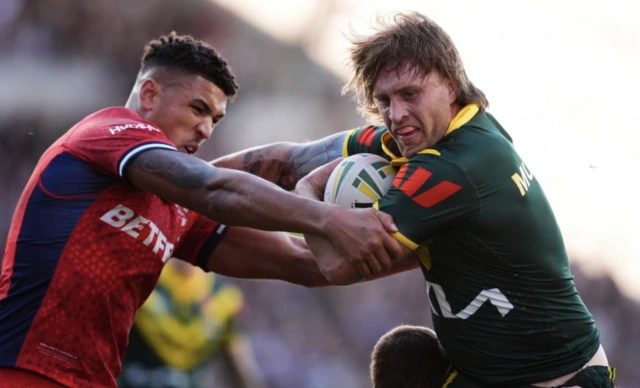 Australia's Patrick Carrigan (right) and England's Kai Pearce-Paul