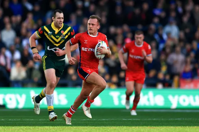 Jez Litten of England runs with the ball