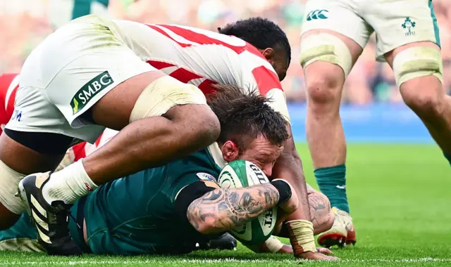 Andrew Porter of Ireland dives over to score his side's third try