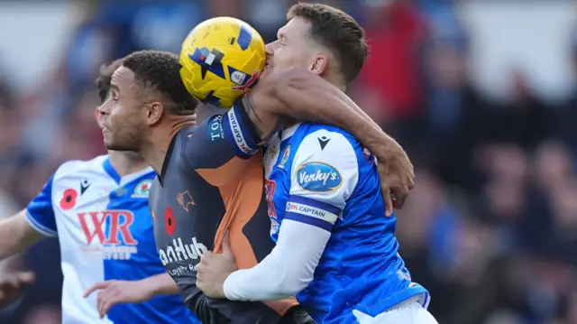 Derby County's Carlton Morris (left) and Blackburn Rovers' Sean McLoughlin battle for the ball
