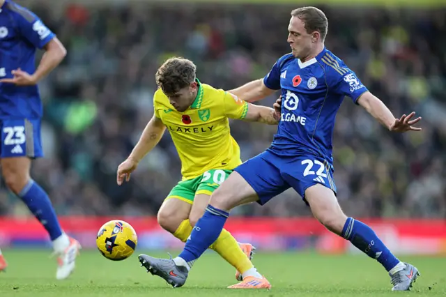 Oliver Skipp of Leicester City in action with Mathias Kvistgaarden of Norwich City