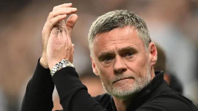 Bradford City boss Graham Alexander applauding supporters