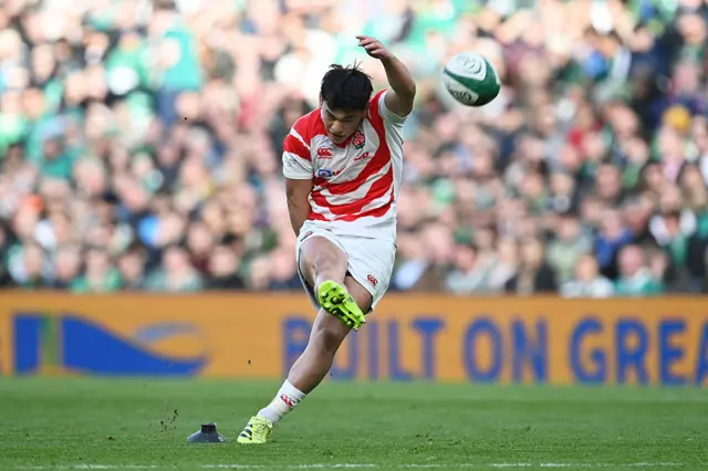 Seungsin Lee of Japan takes a penalty kick