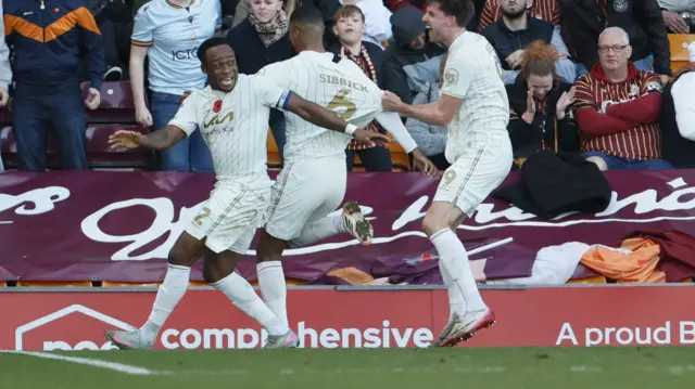 Burton celebrate scoring