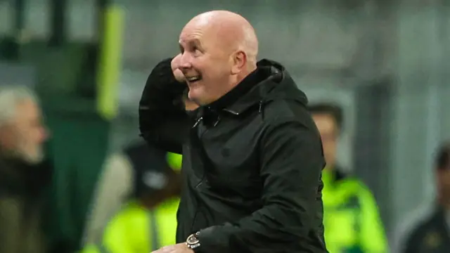 David Martindale cups his ear