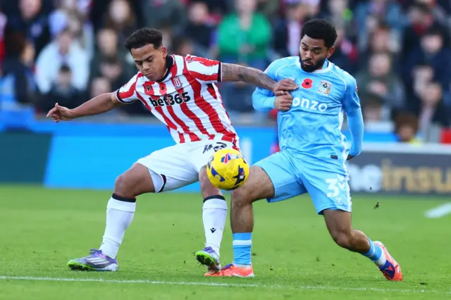 Million Manhoef of Stoke City and Jay Dasilva of Coventry City
