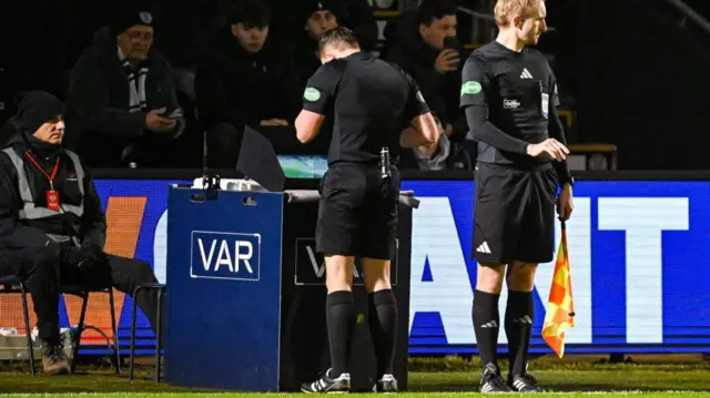 Referee Matthew McDermid constults the VAR monitor before ruling out St Mirren's Miguel Freckleton's strike during a William Hill Premiership match between St Mirren and Heart of Midlothian