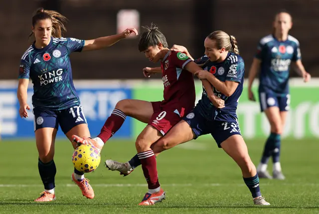 Riko Ueki of West Ham United controls the ball whilst under pressure from Olivia McLoughlin of Leicester City during the Barclays Women's Super League match between West Ham United and Leicester City at Chigwell Construction Stadium