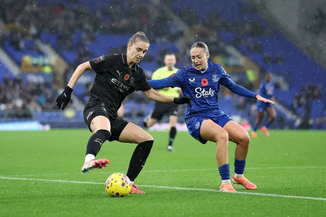 Vivianne Miedema of Manchester City is challenged by Ornella Vignola of Everton during the Barclays Women's Super League match between Everton and Manchester City at Goodison Park on November 09, 2025 in Liverpool, England.