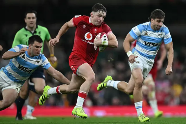 Dan Edwards makes a break for Wales