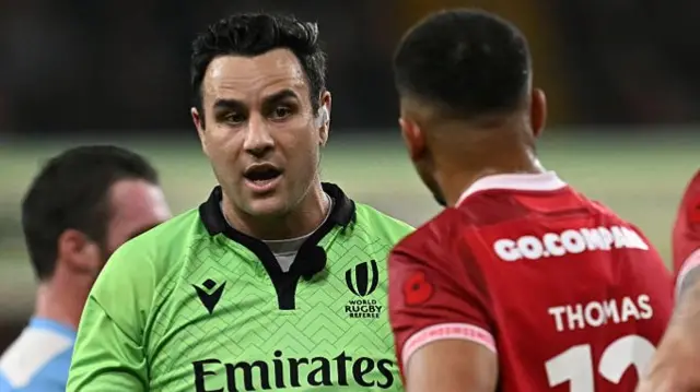 Ben Thomas is shown a yellow card