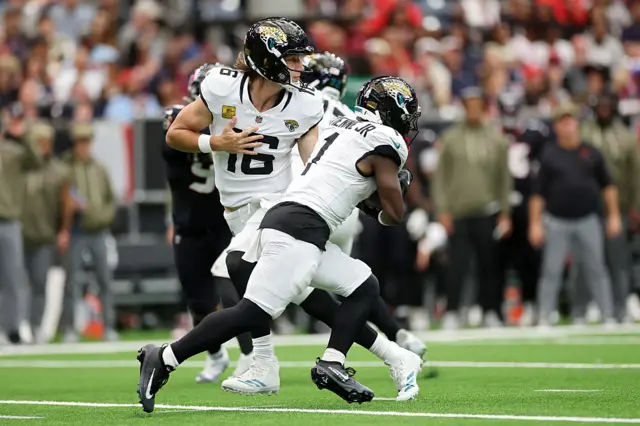 Travis Etienne and Trevor Lawrence