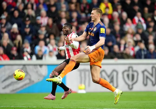 Newcastle United's Dan Burn (right) fouls Brentford's Dango Ouattara resulting in a red card during the Premier League match at the Gtech Community Stadium, London.