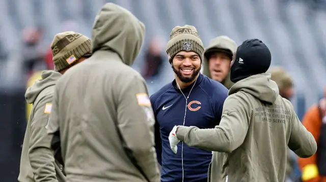 Caleb Williams chatting pre-game