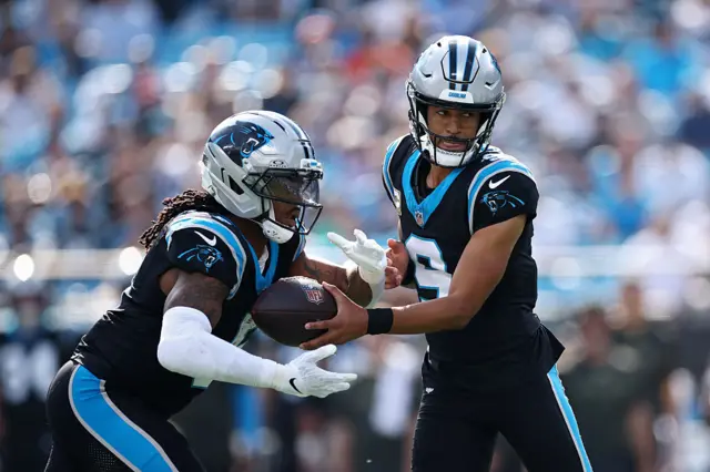 Bryce Young hands off to Rico Dowdle