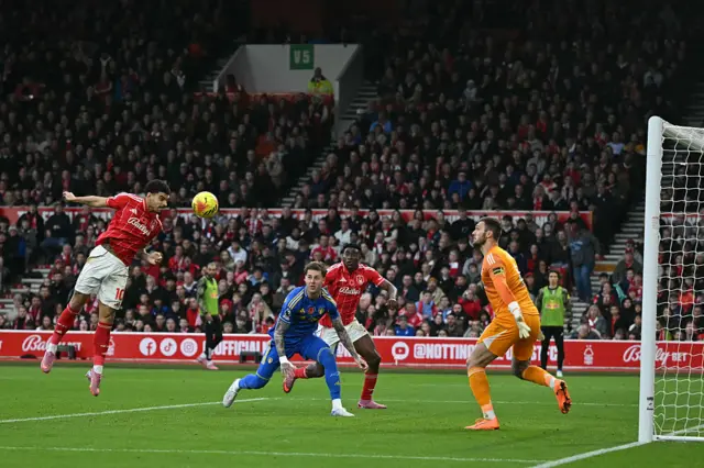 Nottingham Forest's English midfielder #10 Morgan Gibbs-White (L) heads in their second goal during the English Premier League football match between Nottingham Forest and Leeds United at The City Ground in Nottingham, central England, on November 9, 2025.