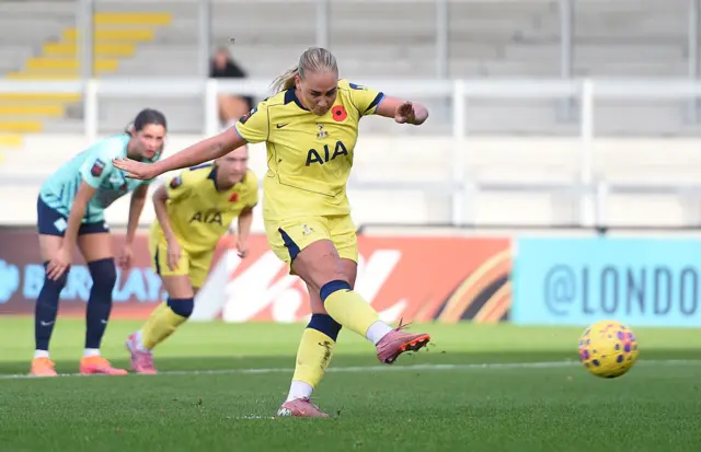 Cathinka Tandberg of Tottenham Hotspur scores her team's first goal from the penalty-spot