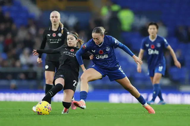 Yui Hasegawa of Manchester City battles for possession with Ornella Vignola of Everton during the Barclays Women's Super League match between Everton and Manchester City at Goodison Park on November 09, 2025 in Liverpool, England.