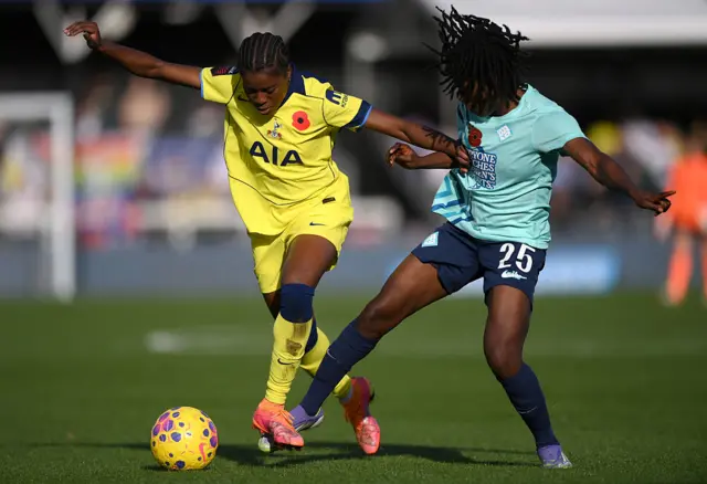 : Jessica Naz of Tottenham Hotspur is challenged by Rofiat Imuran of London City Lionesses during the Barclays Women's Super League match between London City Lionesses and Tottenham Hotspur at Copperjax Community Stadium on November 09, 2025 in Bromley, England.