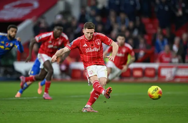 Elliot Anderson of Nottingham Forest scores his team's third goal from the penalty spot during the Premier League match between Nottingham Forest and Leeds United at City Ground on November 09, 2025 in Nottingham, England.
