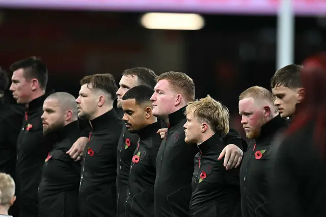Wales players mark the minute silence