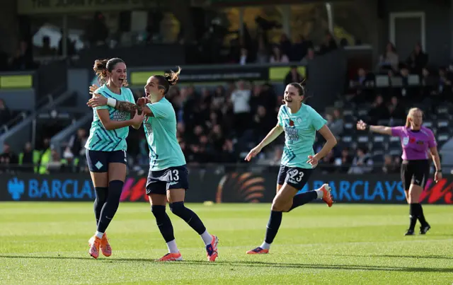 Freya Godfrey of London City Lionesses celebrates with teammate Elena Linari after scoring her team's first goal during the Barclays Women's Super League match between London City Lionesses and Tottenham Hotspur at Copperjax Community Stadium