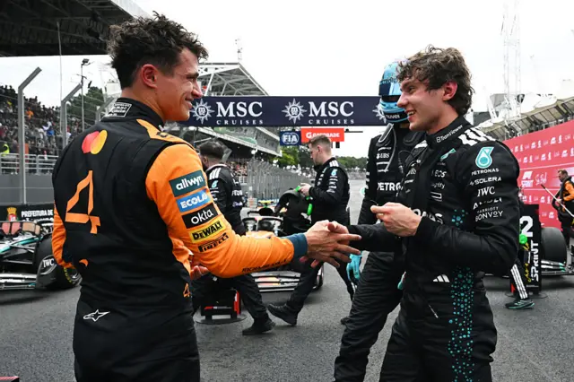 Lando Norris and Kimi Antonelli shake hands