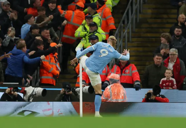 Manchester City's Erling Haaland celebrates scoring their first goal.