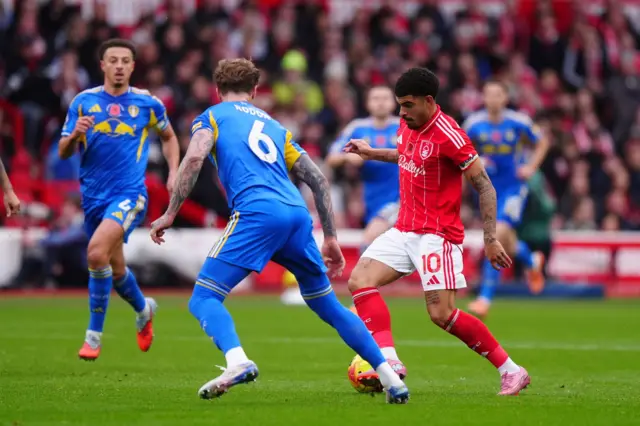 Nottingham Forest's Morgan Gibbs-White (second from right) and Leeds United's Joe Rodon battle for the ball during the Premier League match at City Ground, Nottingham.
