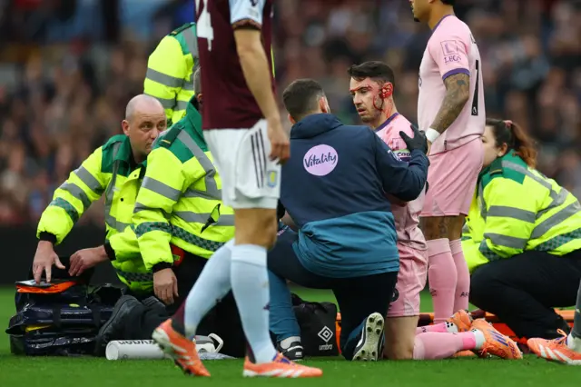 AFC Bournemouth's Adam Smith receives medical attention after sustaining an injury