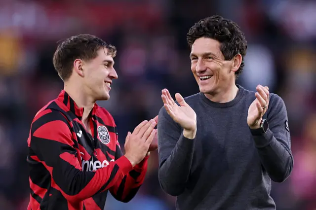 Keith Andrews, Manager of Brentford, applauds the fans at full-time