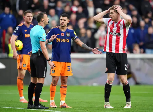 Brentford's Nathan Collins reacts to referee Stuart Attwell after a penalty shout is dismissed during the Premier League match at the Gtech Community Stadium, London.