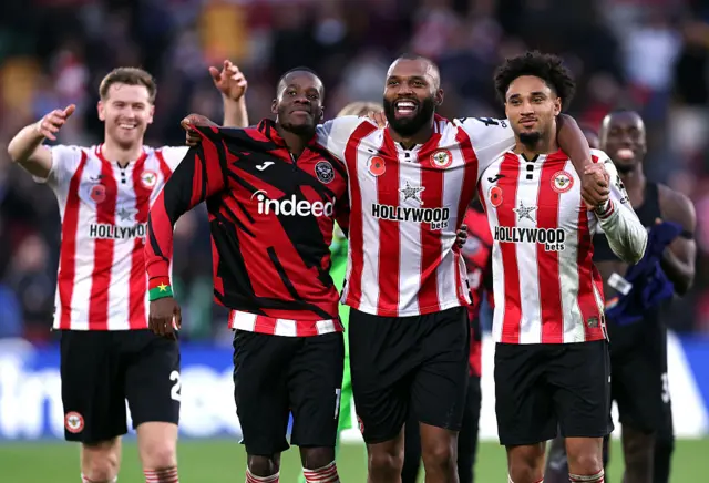 ango Ouattara, Igor Thiago and Kevin Schade of Brentford celebrate following the team's victory in the Premier League match between Brentford and Newcastle United at Gtech Community Stadium on November 09, 2025 in Brentford, England.