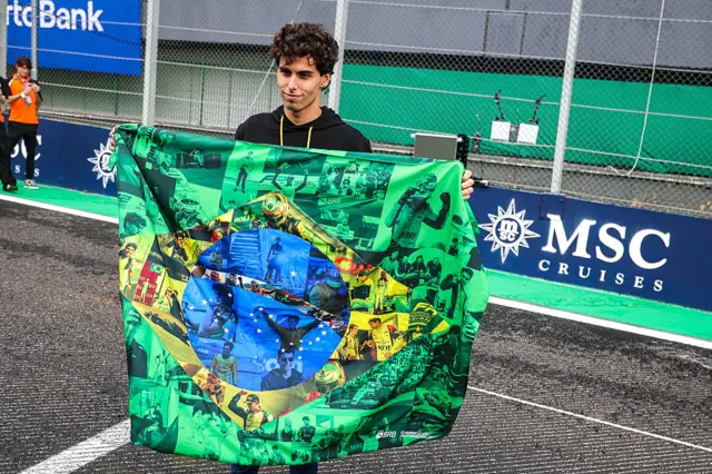 Gabriel Bortoleto holds up a Brazilian flag
