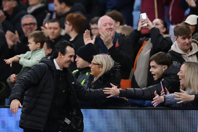 Unai Emery, head coach of Aston Villa, shows appreciation to the fans
