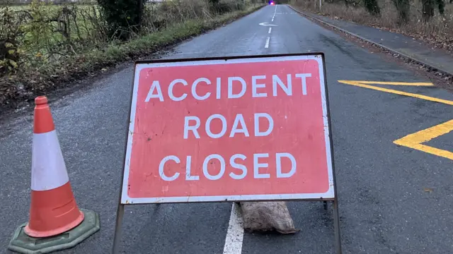 Close-up of a police Road Closed sign
