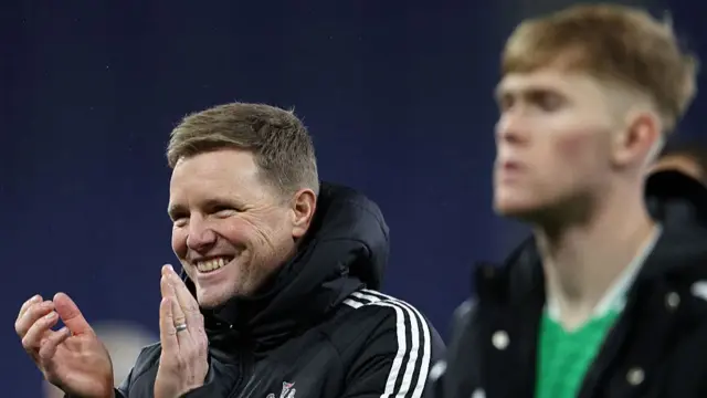 Eddie Howe applauds Newcastle United supporters after the win against Everton