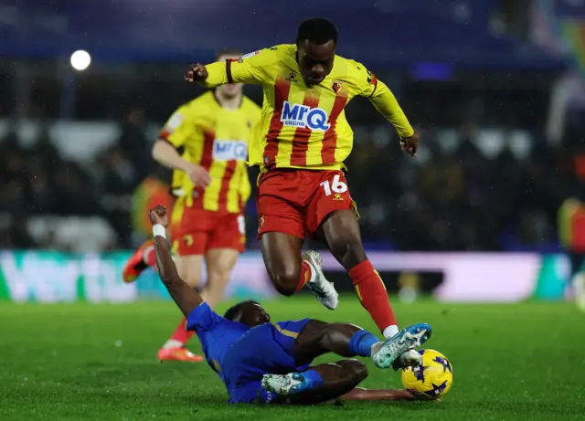 Marc Bola of Watford is challenged by Bright Osayi-Samuel of Birmingham City